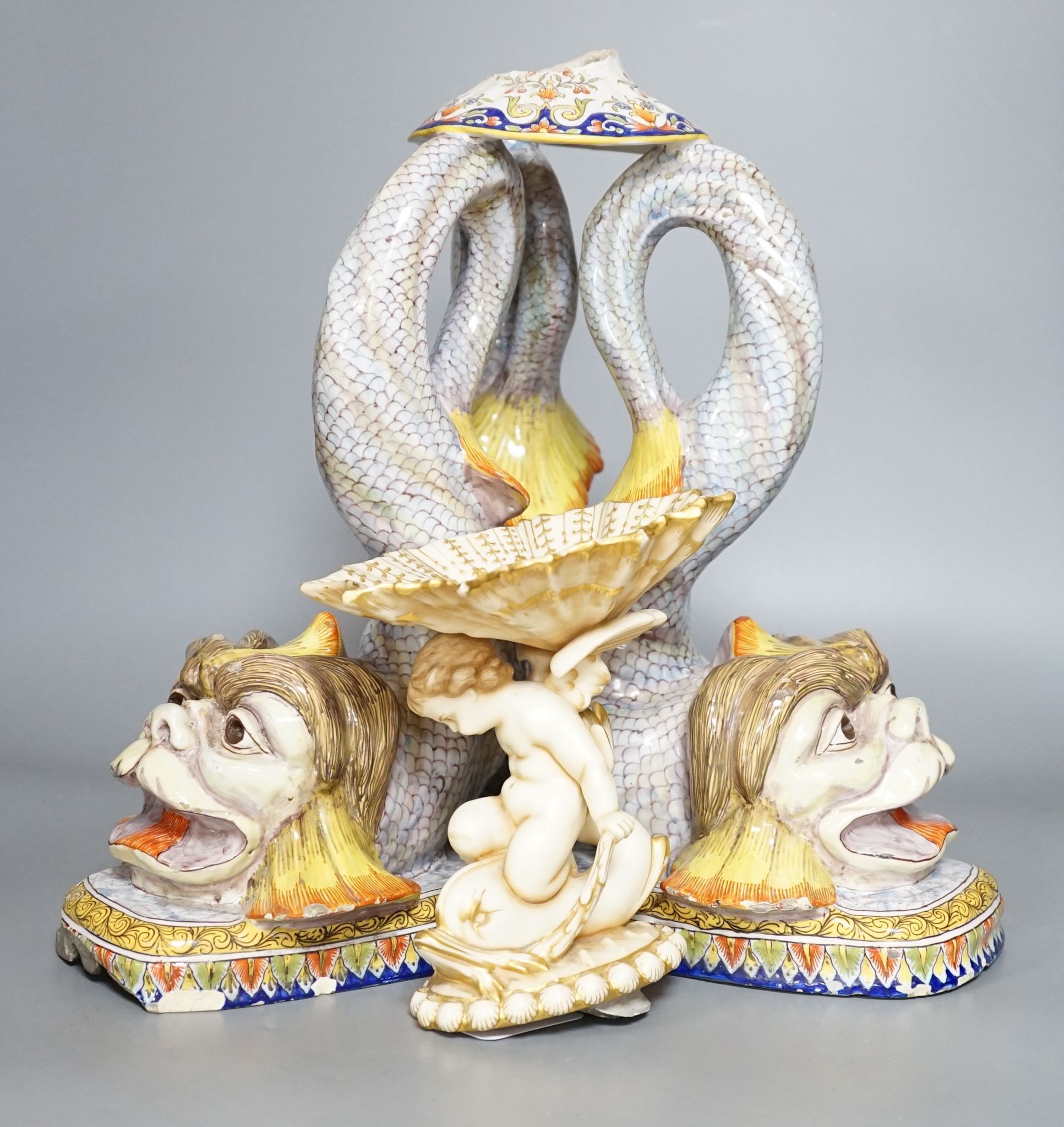 An 18th century Venetian maiolica ‘dolphin’ base and associated blush ivory cherubic figural bowl, 36cm